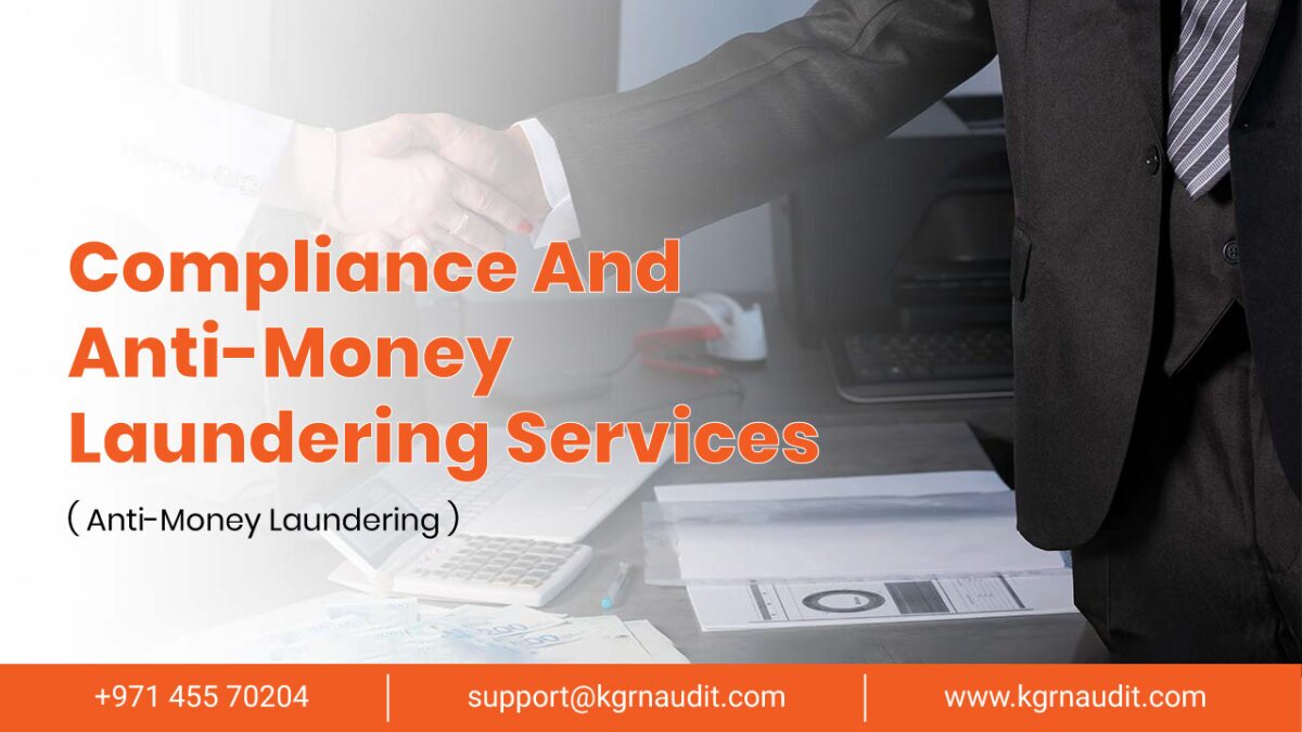 A professional handshake between two people in business attire signifies trust and collaboration. The text reads "Compliance And Anti-Money Laundering Services" with a contact number +971 455 70204 and email support@kgrnaudit.com. Office documents and a computer are visible in the background, underscoring expertise.