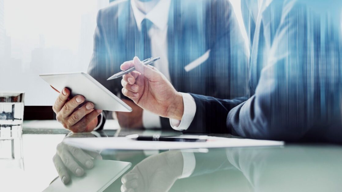 corporate businessmen working on tablet at office